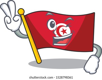 Two finger flag tunisia placed above mascot table
