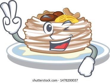 Two finger kataifi character above the a board