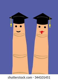Two finger puppets, male and female, wearing their graduation hats with smiles on their faces