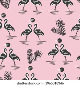 Two flamingos at sunset. A pair of bird silhouettes with palm branches on a pink background. Seamless pattern