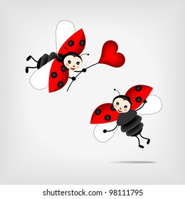 two flying ladybugs holding big red heart