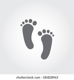 Two foot prints on gray background 