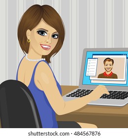 two friends chatting with video call using a laptop sending text messages