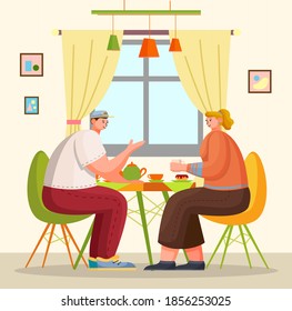 Two friends have lunch or dinner sitting at table at home or in cafe. Couple of guy and girl talking, communicating with cup of tea or coffee. People eating sweet cake. In love couple at date