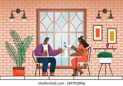 Two friends have lunch or dinner sitting at table at home or in cafe, cafeteria. Black african guy and girl talking, communicating with cup of tea or coffee. In love couple at date, woman and man