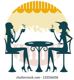 Two friends having a drink and talking