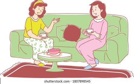 Two friends sit and talk. A tea session. Family session . Guests. Two happy girls. friendship.