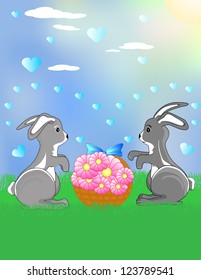Two funny bunnies on the meadow with the flowers
