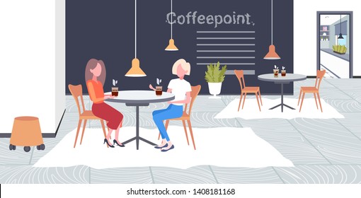 two girls discussing during meeting break for drink at work business time communication concept businesswomen sitting at cafe table modern coffee point interior flat full length horizontal