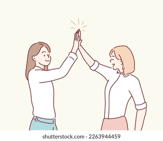 Two girls giving five. Hand drawn style vector design illustrations.