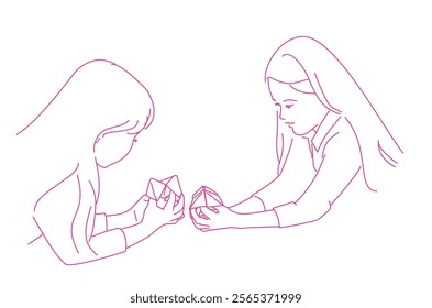 Two girls playing origami fortune game