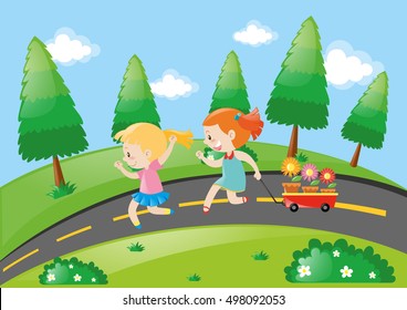Dos chicas tirando del carro en la carretera