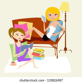 Two girls relax at home,reading book