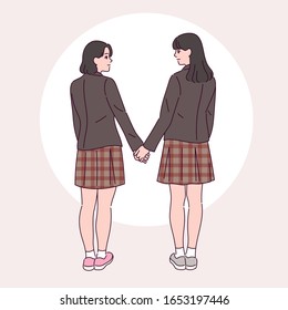 Two girls in school uniform are holding hands with each other intimately. hand drawn style vector design illustrations. 