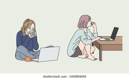 The two girls are sitting on the floor of the room playing computer. hand drawn style vector design illustrations. 