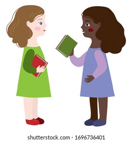 Two girls are talking about books at school. . Schoolchildren communicate. Children are learning.