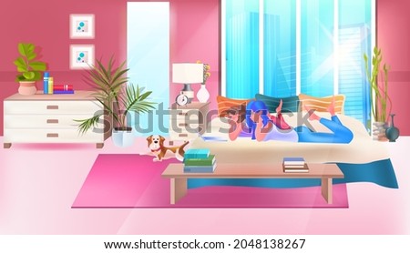 two girls using chatting app on laptop social media network online communication concept bedroom interior