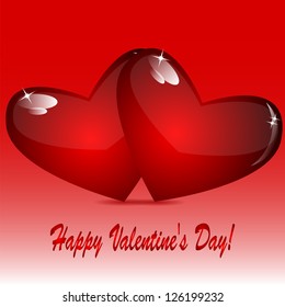 two glass hearts of red color on a red background