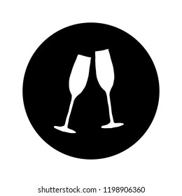 Two glasses with champagne on black background. New Year sign.