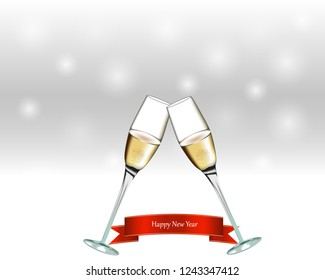 Two glasses with champagne on gray background. New Year sign.
