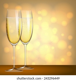 Two glasses of champagne on yellow background