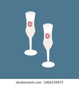 Two glasses of champagne with ribbons and flowers.