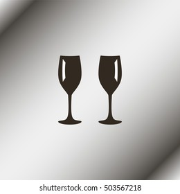 Two glasses of wine or champagne.