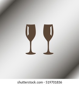 Two glasses of wine or champagne.