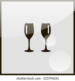 Two glasses of wine or champagne.