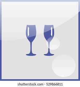 Two glasses of wine or champagne.