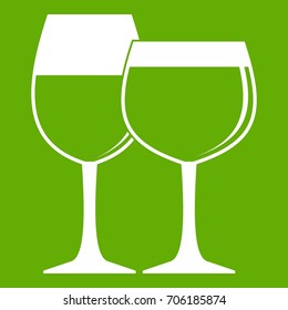 Two glasses of wine icon white isolated on green background. Vector illustration