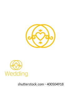 Two gold rings with heart inside.