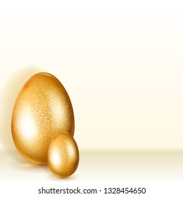 Two golden Easter eggs with soft shadows standing on light background