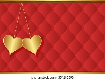 two golden hearts on red background