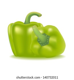 Two green peppers isolated on white background