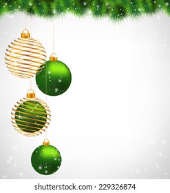 Two green and two spiral golden Christmas balls hanging on pine in snowfall on grayscale background