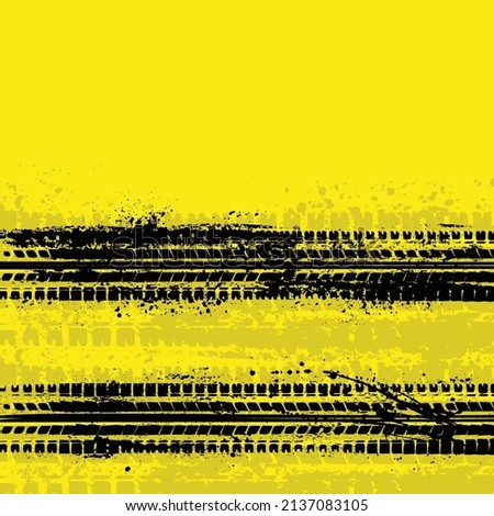Two grunge black tire track silhouettes isolated on yellow background. Ink blots tyre path of vehicle speed braking on the road