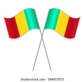 Two Guinean crossed flags. Combined Guinea isolated on white. Language learning, international business or travel concept.