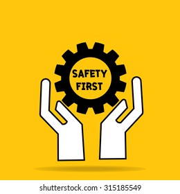 two hand of businessman hold safety first in cog gear importance of safety on yellow background: management business concept