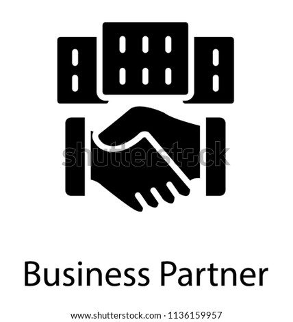 Two hands being shaken in front a commercial building making an icon for business partners  