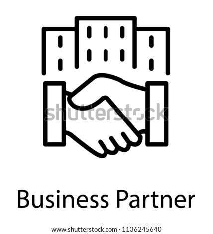 Two hands being shaken in front a commercial building making an icon for business partners  