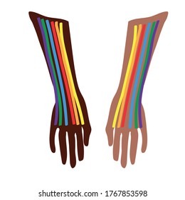 Two hands black and white with the colors of the LGBT flag - fight and protest for homosexual rights. The power of lesbians, gays and transgender people during a protest for freedom and tolerance