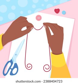 Two hands of a dark-skinned woman holding sewing thread
