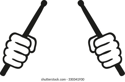 Two hands with drum sticks