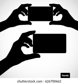 Two hands with fingers spread out and card. Vector silhouettes. Element for your design.