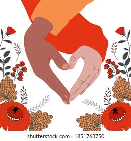 Two hands form a heart icon. African American and European join hands against white background with flowers. Love concept