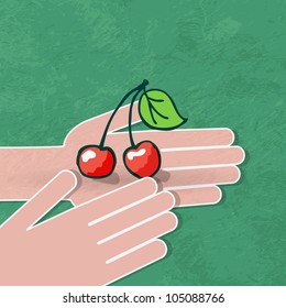 two hands hold a ripe cherry
