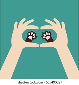 Two hands holding cute cat dog paw print. Love and care pet animals. Helping hand concept. Adopt, donate. Flat design. Green background. Template. Vector illustration