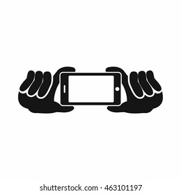 Two hands holding mobile phone icon in simple style isolated on white background. Device symbol