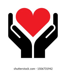 Two hands holding red heart charity and caring symbol on white background.